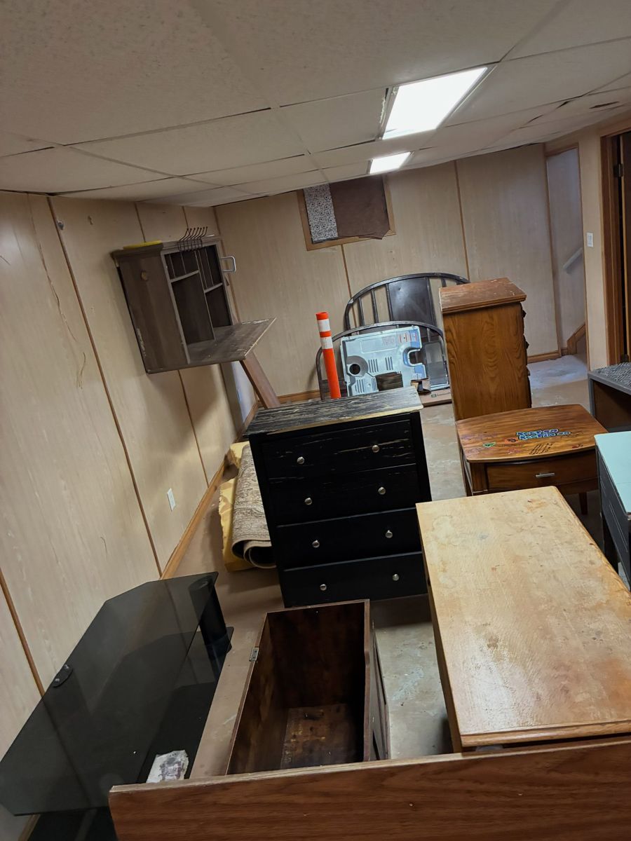 Furniture gathered for removal during an indoor cleanout